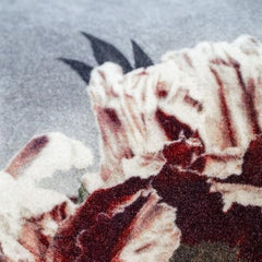 Close up view of the floral print design of the Velvet Peonia Cushion