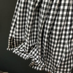 View of the gingham skirt of Jean Marie Lady Lamp