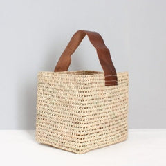 Square woven basket with tan leather handle