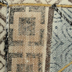 Blockprinted blue natural cushion, close up view of the print design