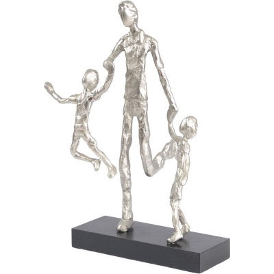 Silver Sculpture of Father and two children skipping.