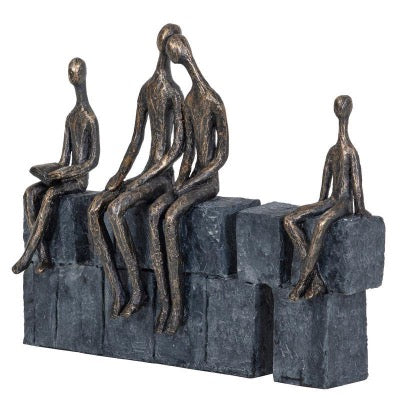 Bronze family of four on grey stone effect blocks