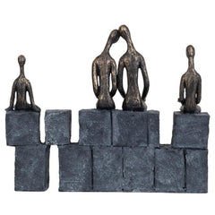 Bronze family of 4 sculpture on grey stone effect blocks back view