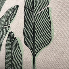 Close up look of the Palm Print in black and green on a beige fabric