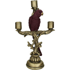 Carnaby Purple Parrot Candlestick.The beautiful purple resin cockatoo is perched on a detailed tree branch structure in antique gold for an authentic touch.